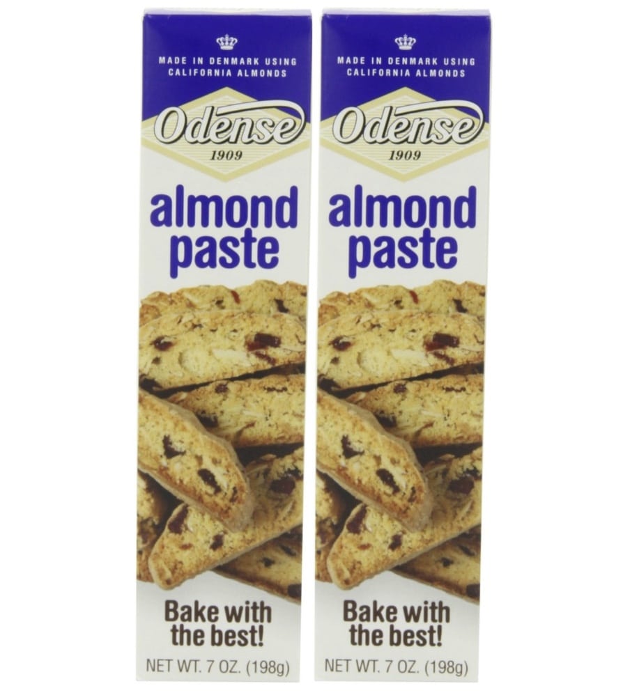 Two packages of Odense almond paste are shown. The blue and white boxes feature cookies on the front, along with text that reads "Odense 1909," "almond paste," "Bake with the best!," and "Net Wt. 7 oz. (198g)." Perfect for your next banket recipe!